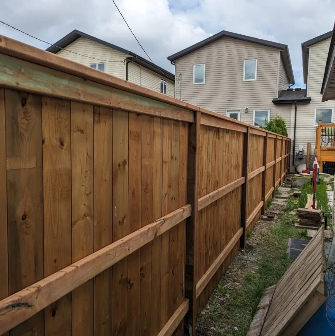Cedar wood fence installation
