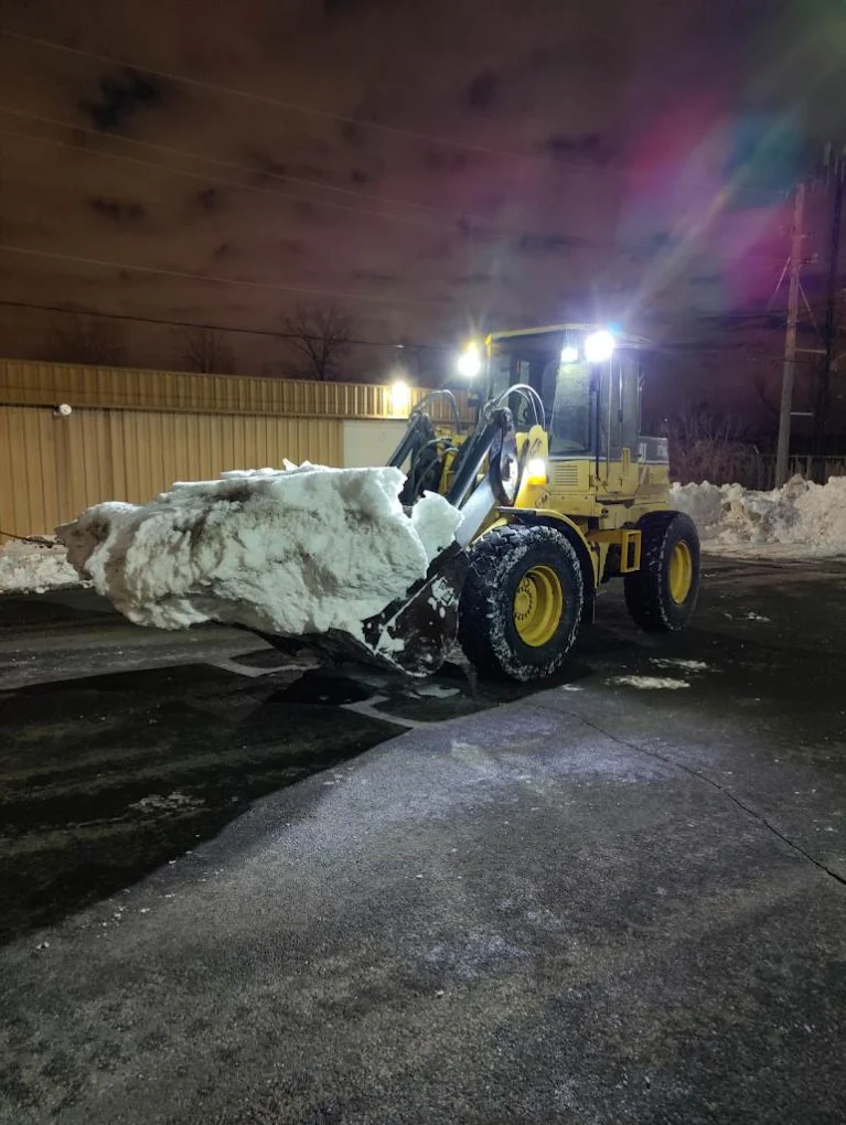 Commercial snow hauling loader operation